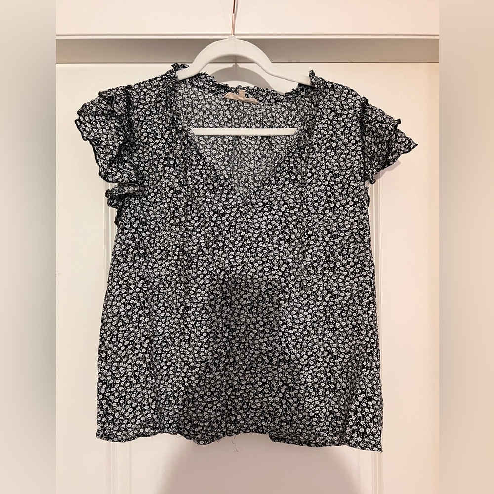 Lightweight V-neck peasant style with flounce at shoulder